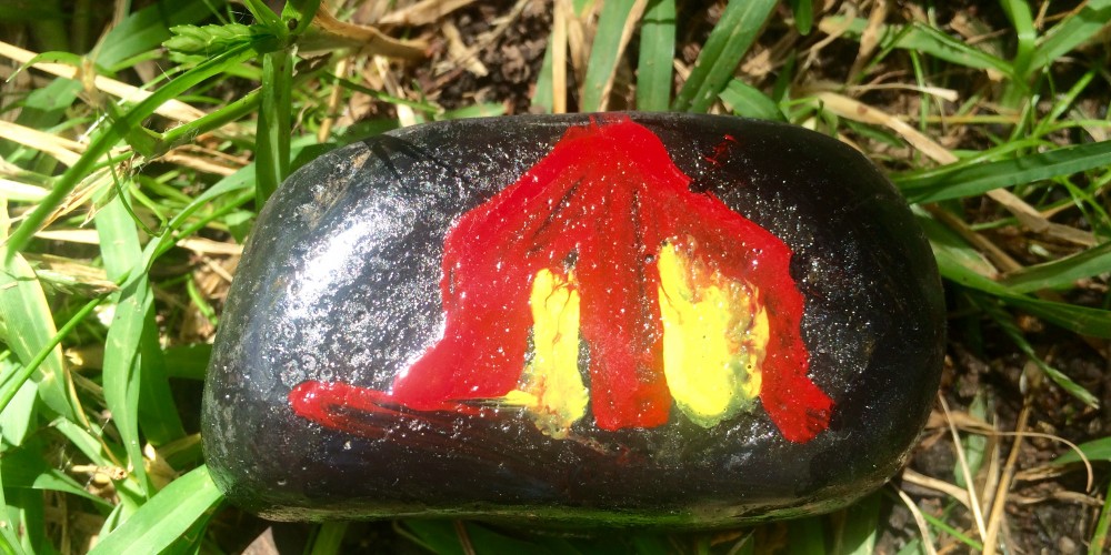 A tent filled with the glow from a torch